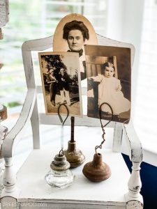 Vintage doorknobs flipped over with thick wire coming out of the doorknob to hold pictures in.
