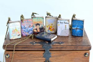 Personalized necklaces of a favorite book cover.