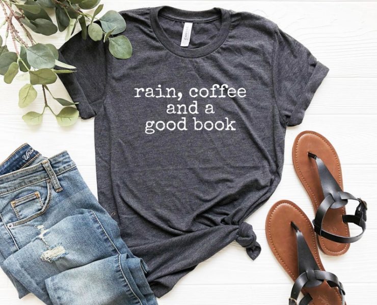 Gray t-shirt with the quote "rain, coffee and a good book" printed on it in typewriter font.
