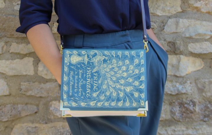 Cross-body bag made to look like a blue and gold cover or Pride and Prejudice.