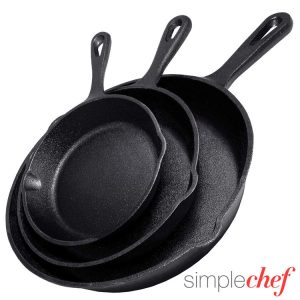 Set of three black cast-iron skillets, varying in size, one of our favorite gifts for new homeowners!
