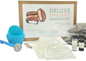 Deluxe chocolate making kit with contents in front of the box, one of our 'gifts for him.'