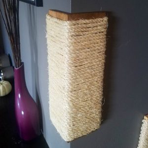Cat scratching post with thick twine that fits against the corner of the wall.
