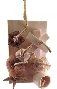 Bird toy made out of shreddable wood pieces.