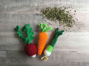 Knit cat toys in the shape of vegetables with catnip stuffed inside, great gifts for pets.