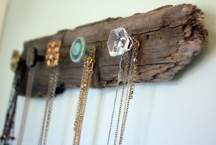 Wall necklace rack made with vintage doorknobs.