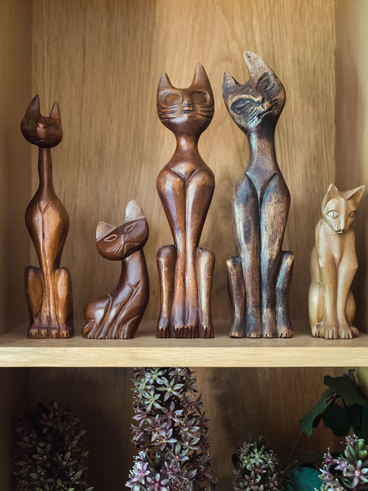 A collection of wooden cat decor that steal the show.
