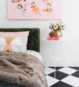 Headboards that are lined with green faux turf.