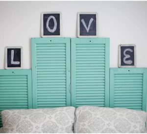 Vintage shudders meant to serve as the headboards of the past.