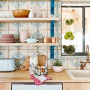 Vintage-inspired backsplash tiles with a blue and cream color scheme.