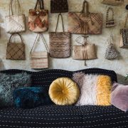 An array of antique purses in different shapes, styles, and colors as a part of Victoria's vintage collectibles.