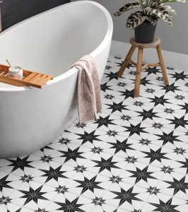 Backsplash tiles with a black and white starburst motif.