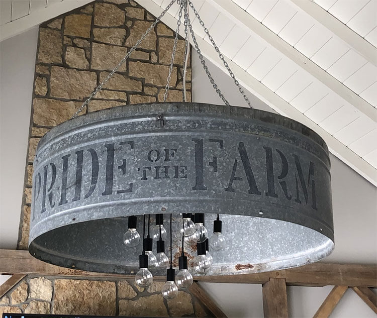 A chandelier fashioned out of an iron pig trough as a part of the day in the life story.