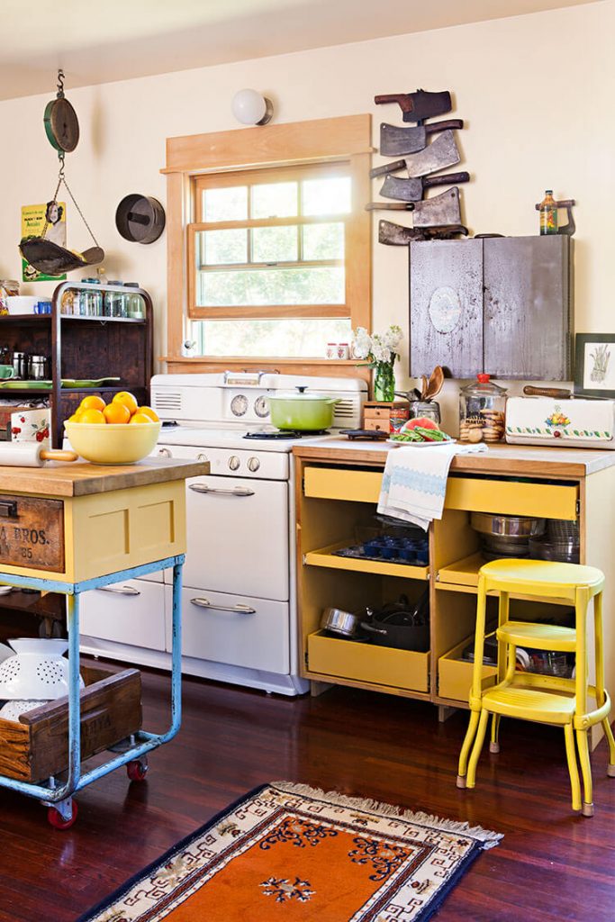A rustic renovation showcasing a kitchen with yellow-toned furniture.