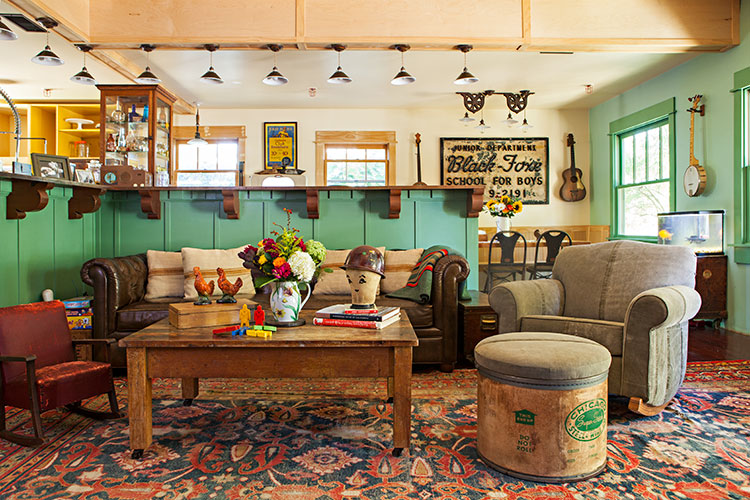 A rustic renovation detailing the home's living room and its antique fixtures.