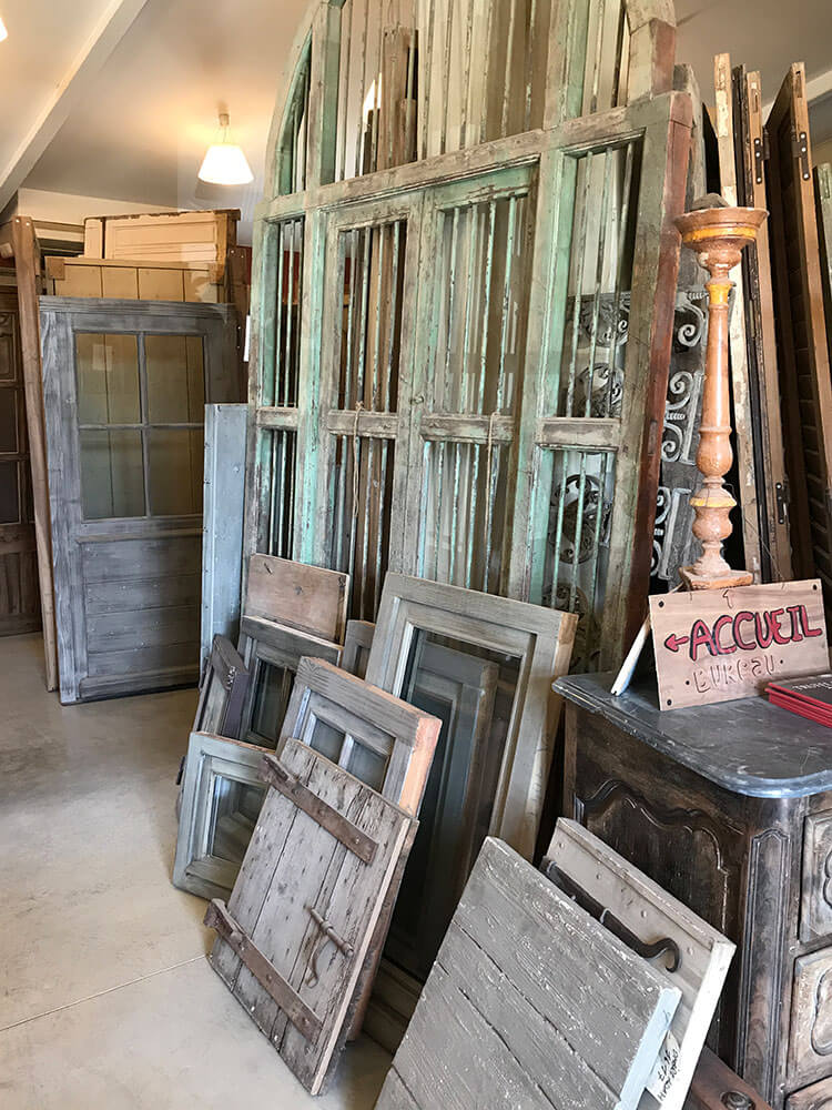 An array of wooden doors and windows.