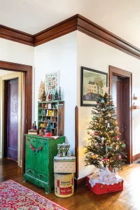 vintage tins serve as stands to display Christmas trees and mini houses