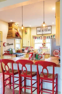 vintage tins on display on kitchen counter with fabric valence