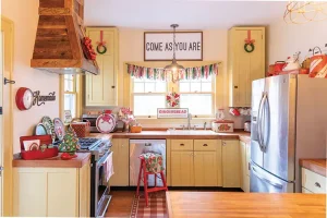 vintage inspired kitchen with yellow cabinets and red and white check flooring