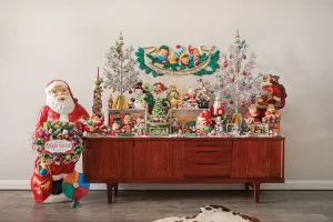 mid century style credenza with aluminum trees and vintage Santa and snowman figurines
