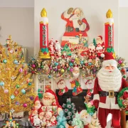 vintage Santas and reindeer and ornaments create a maximalist vintage holiday mantel