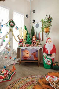 Rudolph the Red Nosed Reindeer playing on vintage style TV in room with aluminum tree