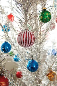 aluminum tree with bright ornaments