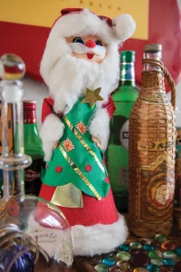 felt Santa holding a Christmas tree in whimiscal holiday home