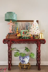 small white mini tree with colorful ornaments and vintage holiday scene