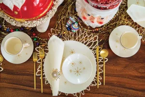 starburst place settings and large Santa serving bowl in whimsical holiday tablescape