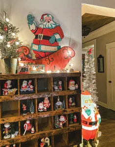 vintage shelf with Santa figurine collection