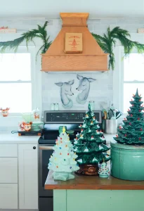 vintage glass Christmas trees in kitchen with deer theme