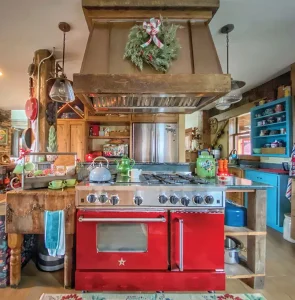 Old world dstyle kitchen with wreath on oven hood