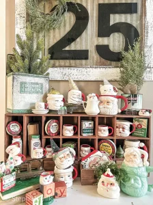 holiday vignette with vintage tins and Santa mugs