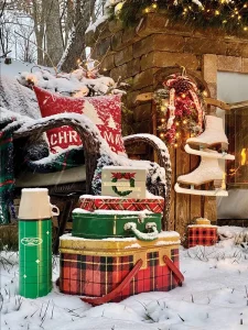 vintage lunch tins and thermos on display in snowy backyard