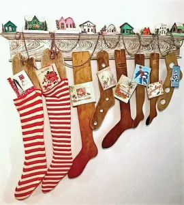 putz houses and stripped socks hanging grom vintage wooden foot molds