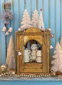 vintage jewelry case houses white Santa mugs in third annual Santa Stopper