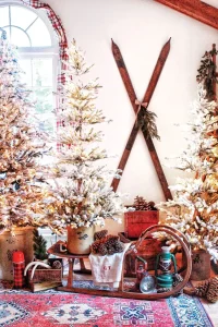 vintage skis and sled between Christmas trees