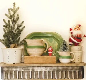 vintage vignette with Santa figurines and mini trees