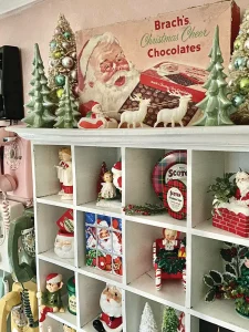 collection of vintage Christmas figurines and chocolate box