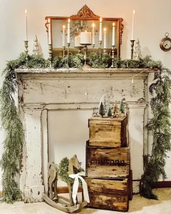 vintage wooden crates in simple mantel display with candelabra and cedar garland
