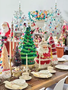large tree and Santa figurines serve as tablescape centerpiece in third annual Santa Stopper gallery