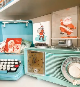 mint clock radio and turquoise vintage typewriter