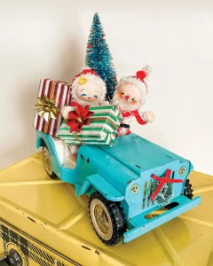 vintage blue toy truck with Mr and Mrs Claus