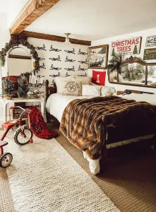 vintage Christmas tree sign and wreath around mirror in rustic bedroom