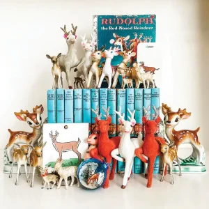 vintage books with reindeer figurines