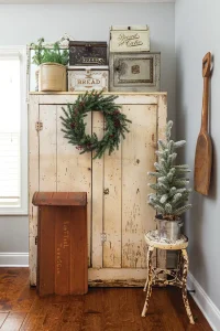 vintage cabinet with vintage sled and bread boxes