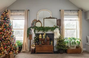 vintage ornaments on Christmas tree along with various bottlebrush trees in living room of modern collected farmhouse