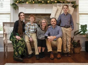 Emily with her family in modern collected farmhouse