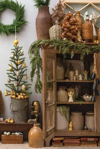 neutral Christmas vignette with vintage angel figurines and cedar garland